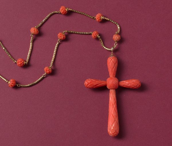 Antique Georgian Carved Coral Cross and Chain Necklace; with geometrical kite shaped and pine shaped decorations, on gold chain with carved coral beads
