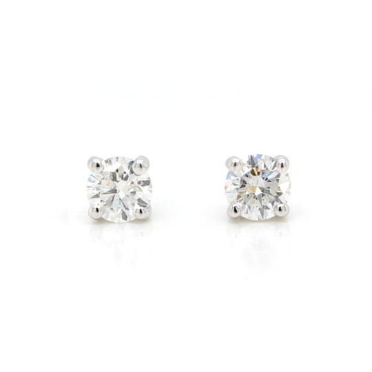 Pair of Diamond Single-Stone Solitaire Stud Earrings; featuring two round brilliant-cut diamonds totaling 0.82 carats, four-claw set, in 18ct white gold.
