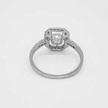 Emerald Cut Diamond Cluster Ring in 18ct White Gold; central 0.75ct emerald-cut diamond surrounded by 0.25ct diamond border and diamond set shoulders, 1.00 carat total