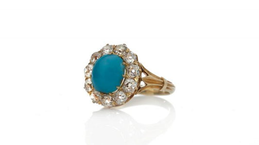 Antique Victorian Turquoise and Old Cut Diamond Cluster Ring; central 2.50ct round cabochon cut turquoise surrounded by 1.65cts old cut diamonds, in 15ct yellow gold, Circa 1870s