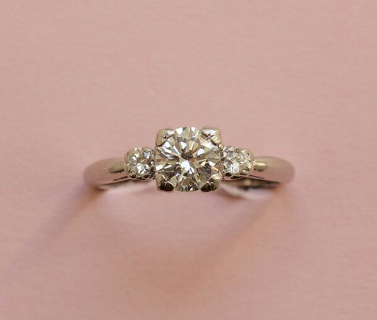 Art Deco 0.75ct Diamond and Platinum Three Stone Ring, 0.75 carat total, colour E/F, heart shaped claws, Signed Caldwell & Co., Circa 1920