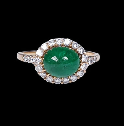 Vintage 2ct Cabochon Emerald and Diamond Cluster Ring; high domed emerald cabochon surrounded by brilliant cut diamonds, in 18ct yellow gold. French, Circa 1960s