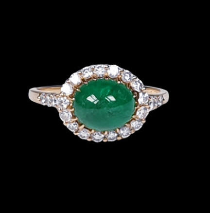 Vintage 2ct Cabochon Emerald and Diamond Cluster Ring; high domed emerald cabochon surrounded by brilliant cut diamonds, in 18ct yellow gold. French, Circa 1960s