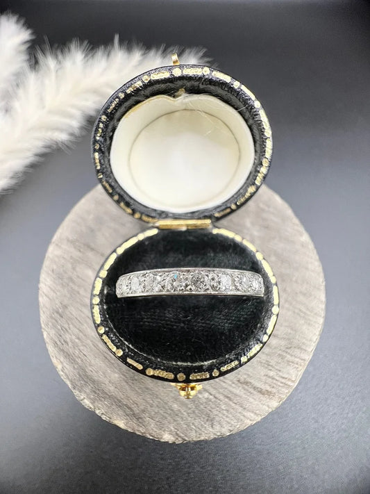 A diamond full eternity band ring in platinum, in a ring box