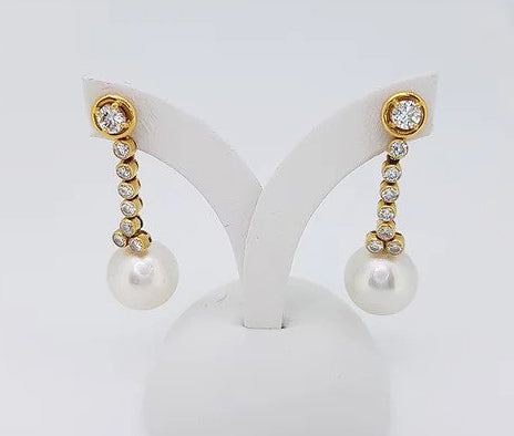 Vintage South Sea Pearl and Diamond Drop Earrings; featuring South Sea pearls suspended by a row of diamonds, in 18ct yellow gold