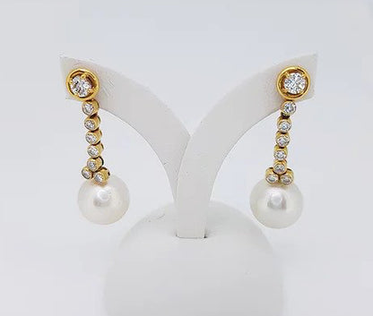 Vintage South Sea Pearl and Diamond Drop Earrings; featuring South Sea pearls suspended by a row of diamonds, in 18ct yellow gold