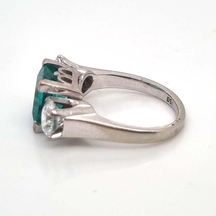 2.36ct Square Step Cut Emerald and 1.50ct Diamond Three Stone Trilogy Engagement Ring in 18ct White Gold