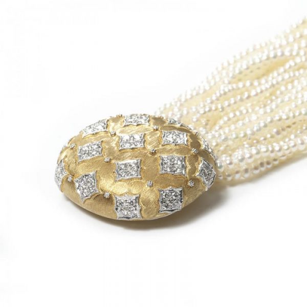 Contemporary Multi Row Pearl Bracelet with Diamond set 18ct Gold Clasp; oval gold clasp decorated with quatrefoils of 2.75cts round brilliant cut diamonds