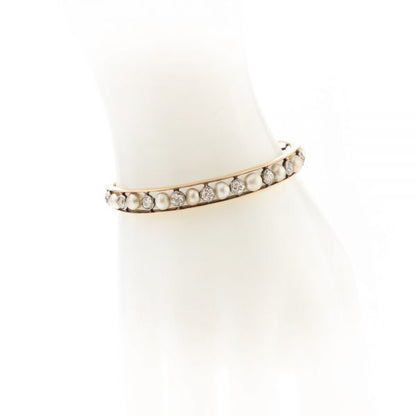 Antique Edwardian Natural Pearl and Old Cut Diamond Bangle Bracelet; set with certified natural saltwater pearls and 2.75cts old cut diamonds, in 15ct gold and platinum