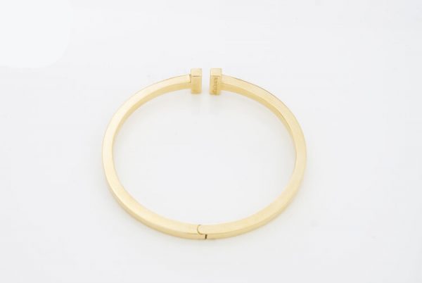 Tiffany and Co 18ct Yellow Gold Double T-Bar Bangle with 1.60cts Princess Cut Diamonds. Comes in Tiffany & Co box