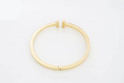 Tiffany and Co 18ct Yellow Gold Double T-Bar Bangle with 1.60cts Princess Cut Diamonds. Comes in Tiffany & Co box