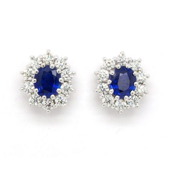 Pair of 1.47ct Sapphire and 0.88ct Diamond Oval Cluster Earrings; central oval faceted sapphires surrounded by brilliant cut diamonds, 18ct white gold.