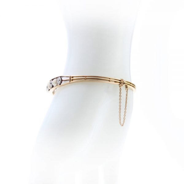 Antique Edwardian Natural Pearl and Old Cut Diamond Bangle Bracelet; set with certified natural saltwater pearls and 2.75cts old cut diamonds, in 15ct gold and platinum