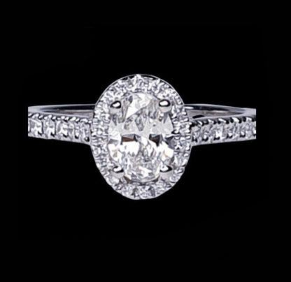 Diamond Oval Cluster Engagement Ring; GIA certified 0.50 carat F colour SI1 clarity oval faceted with diamond surround and diamond-set shoulders, in Platinum