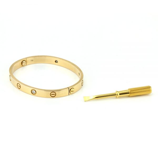 Cartier 18ct Rose Gold Love Bangle Bracelet set with four brilliant cut diamonds, Circa 2000s. Comes with Cartier box, gold screwdriver and certificate / insurance valuation from Cartier in Harrods London