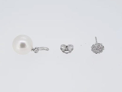 South Sea Pearl and Diamond Drop Earrings; featuring South Sea pearls suspended from cluster diamond studs. Mounted in 18ct white gold.