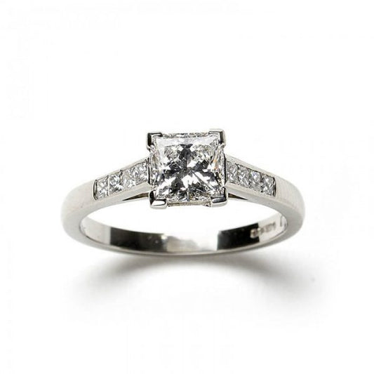 A diamond engagement ring, set with a 1.03 carat, F colour, VS1 clarity, princess-cut diamond, diamond set shoulders, in platinum, with GIA certificate.
