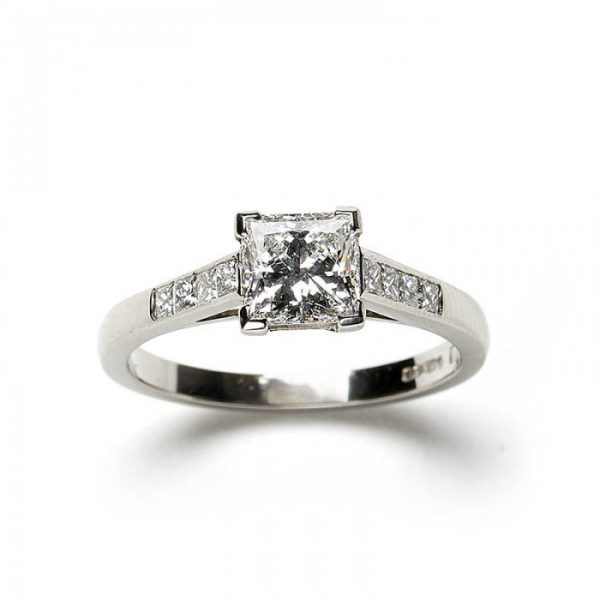 A diamond engagement ring, set with a 1.03 carat, F colour, VS1 clarity, princess-cut diamond, diamond set shoulders, in platinum, with GIA certificate.