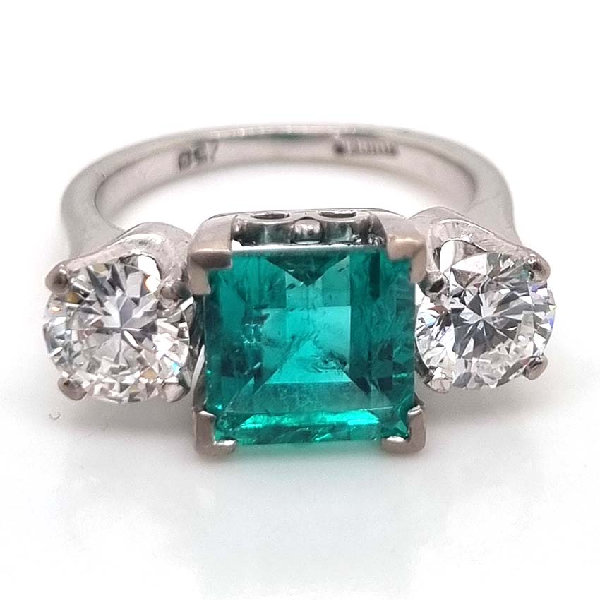 2.44 carat Colombian emerald and diamond engagement ring Three stone
