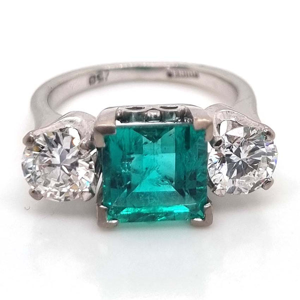 2.44 carat Colombian emerald and diamond engagement ring Three stone
