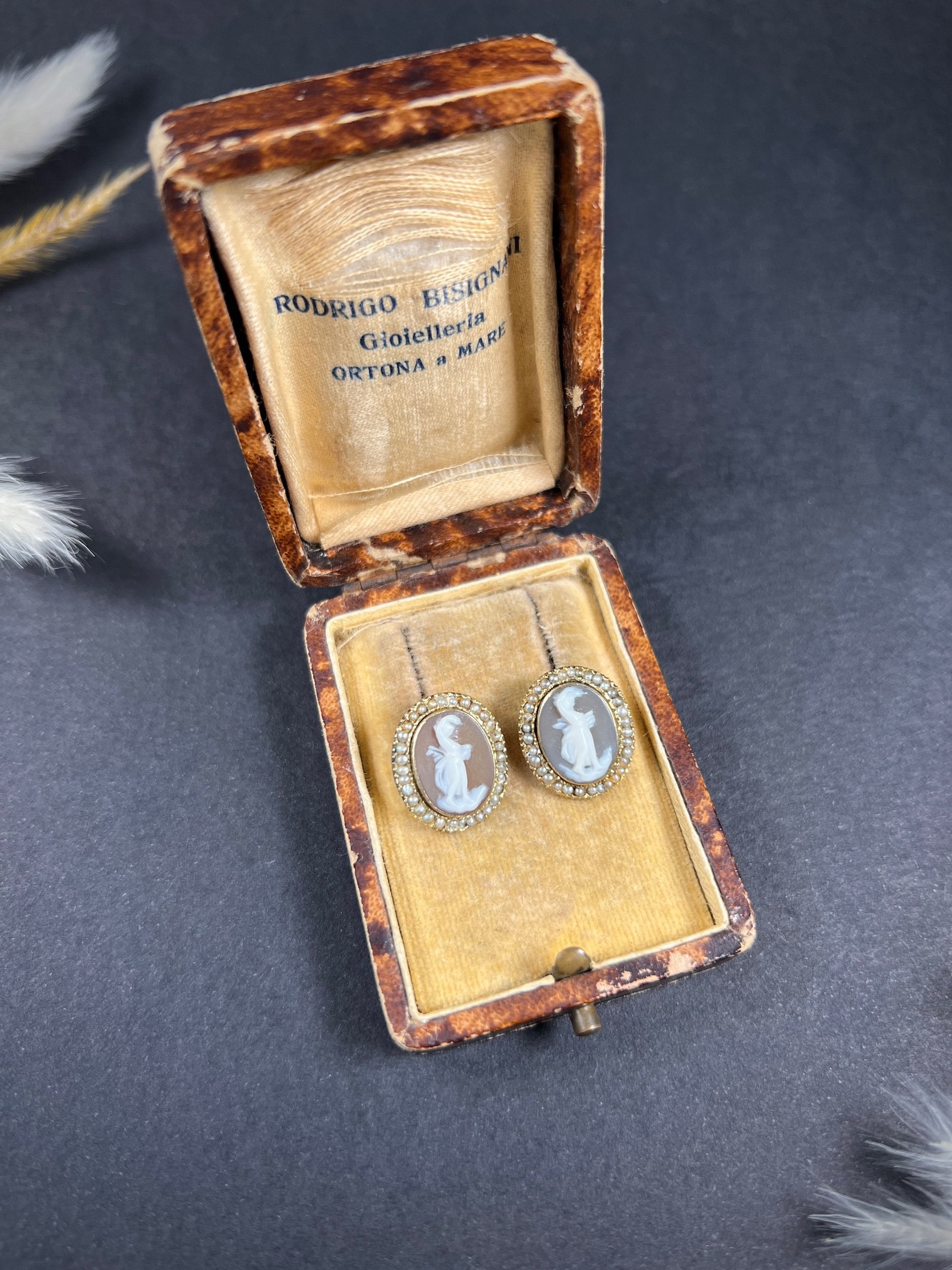 A pair of yellow gold oval shell cameo earrings, in an antique box