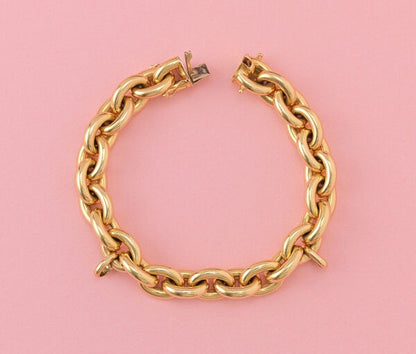 Vintage French 18ct Yellow Gold Link Bracelet, with two large links for charms and a hidden lock. France, Circa 1980.
