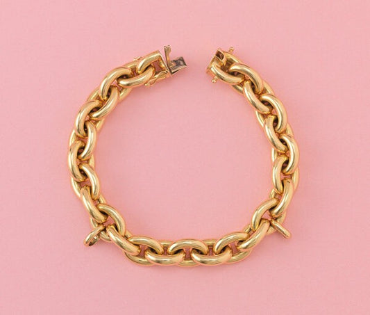 Vintage French 18ct Yellow Gold Link Bracelet, with two large links for charms and a hidden lock. France, Circa 1980.