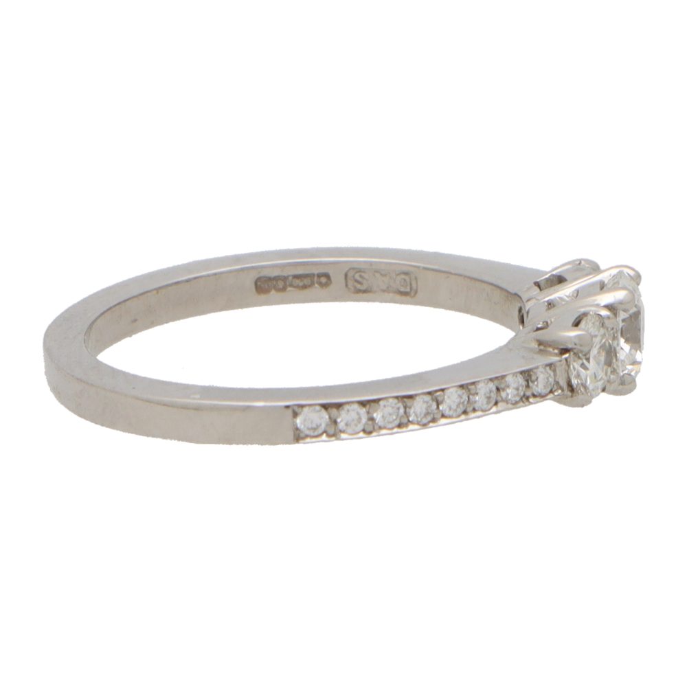 Modern Diamond Three Stone Ring With Diamond Shoulders in Platinum