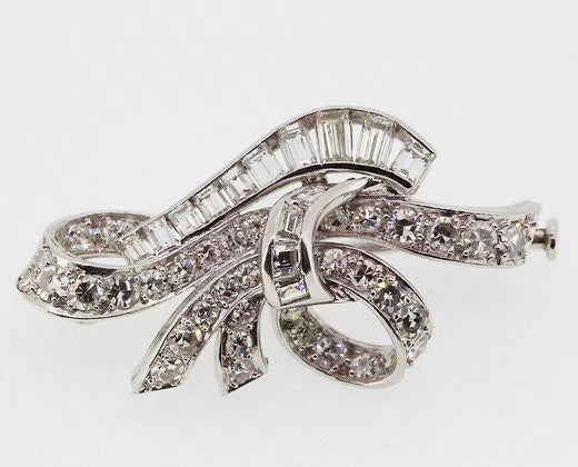 Vintage Diamond Bow Brooch, set with brilliant-cut and baguette-cut diamonds, in 18ct white gold