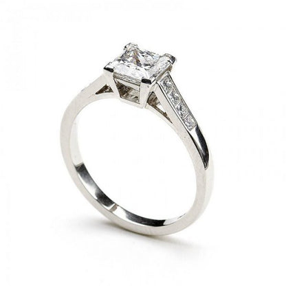 A diamond engagement ring, set with a 1.03 carat, F colour, VS1 clarity, princess-cut diamond, diamond set shoulders, in platinum, with GIA certificate.