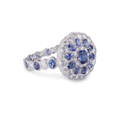 Tanzanite and Rose Cut Diamond Cuff Bracelet; central oval tanzanite, encased with rose-cut diamonds and pear-cut tanzanites, 43.27ct total, 18ct white gold
