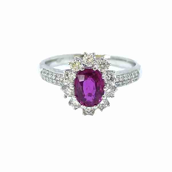 Burma Ruby and Diamond Cluster Ring in Platinum; 1.16 carat oval faceted Burmese ruby claw set within a diamond surround, with two rows of diamonds set into each shoulder