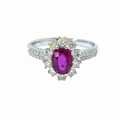 Burma Ruby and Diamond Cluster Ring in Platinum; 1.16 carat oval faceted Burmese ruby claw set within a diamond surround, with two rows of diamonds set into each shoulder