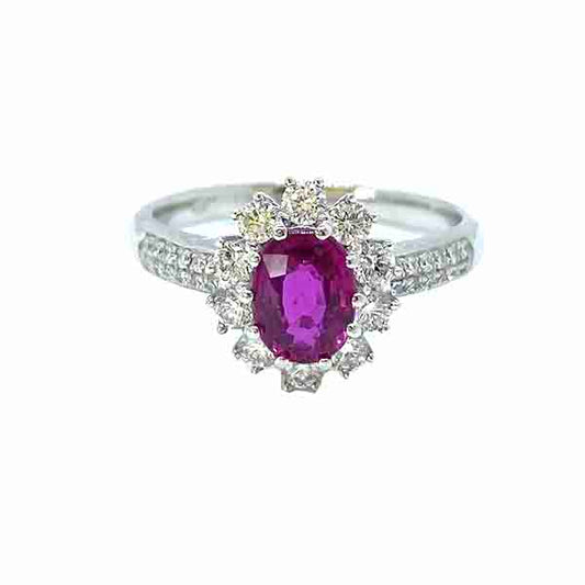 Burma Ruby and Diamond Cluster Ring in Platinum; 1.16 carat oval faceted Burmese ruby claw set within a diamond surround, with two rows of diamonds set into each shoulder