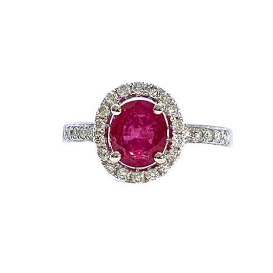 Ruby and Diamond Halo Cluster Engagement Ring; 1.71ct oval ruby with no indication of heat treatment with diamond halo and diamond shoulders, 18ct white gold
