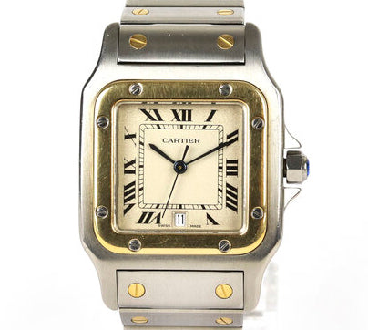 Cartier Santos Galbée 29mm Steel and Gold Quartz Square Watch, white dial, Roman numerals, date aperture at 6, blue steel hands, sapphire crystal glass, faceted blue gem set crown, stainless steel and yellow gold bracelet, with a stainless steel single deployment clasp