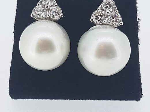 South Sea Pearl and Diamond Trefoil Earrings; 15mm South Sea pearls accented with 1.70ct trefoil diamond tops, 18ct white gold