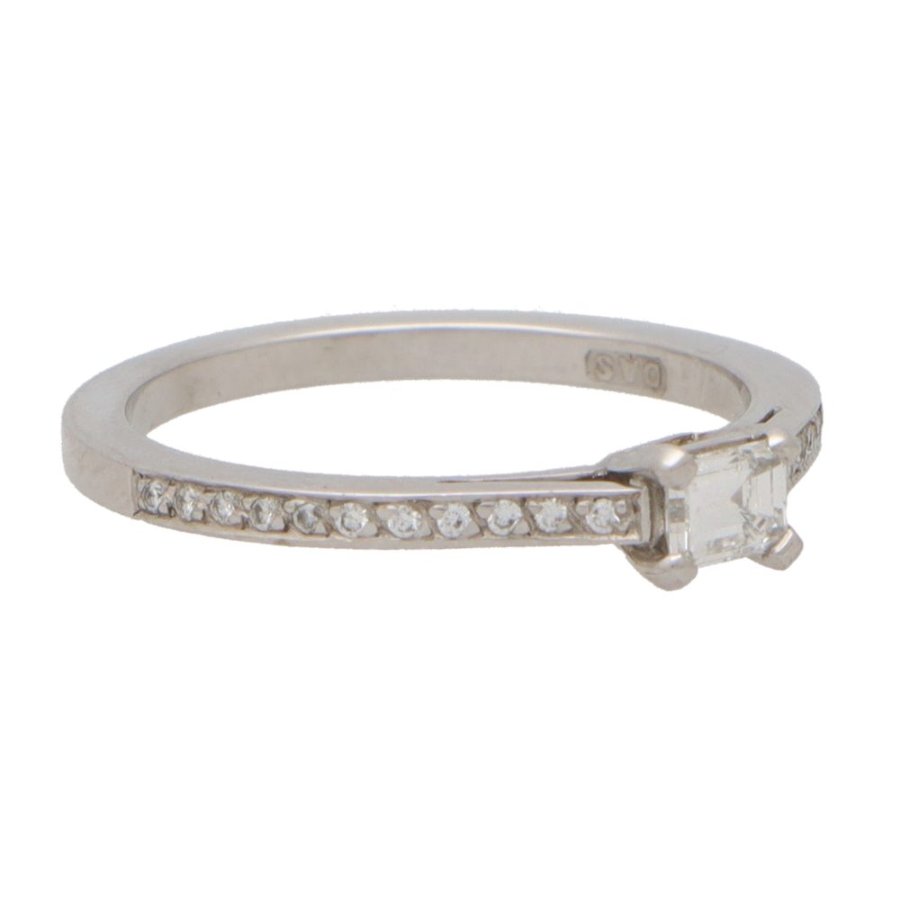 Modern Emerald Cut Diamond Ring With Diamond Shoulders in Platinum