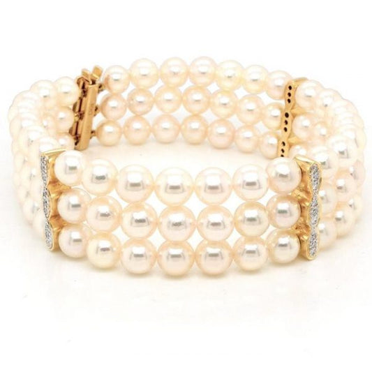 Pearl Three Row Bracelet with Diamond Set Spacer Bars; triple row cultured pearl bracelet with diamond-set 18ct yellow gold spacer bars
