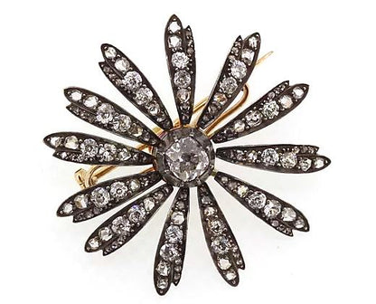 Antique Victorian 1.20ct Old Cut Diamond Daisy Flower Brooch; central 1.20 carat old-cut diamond, with diamond set petals, in silver and gold