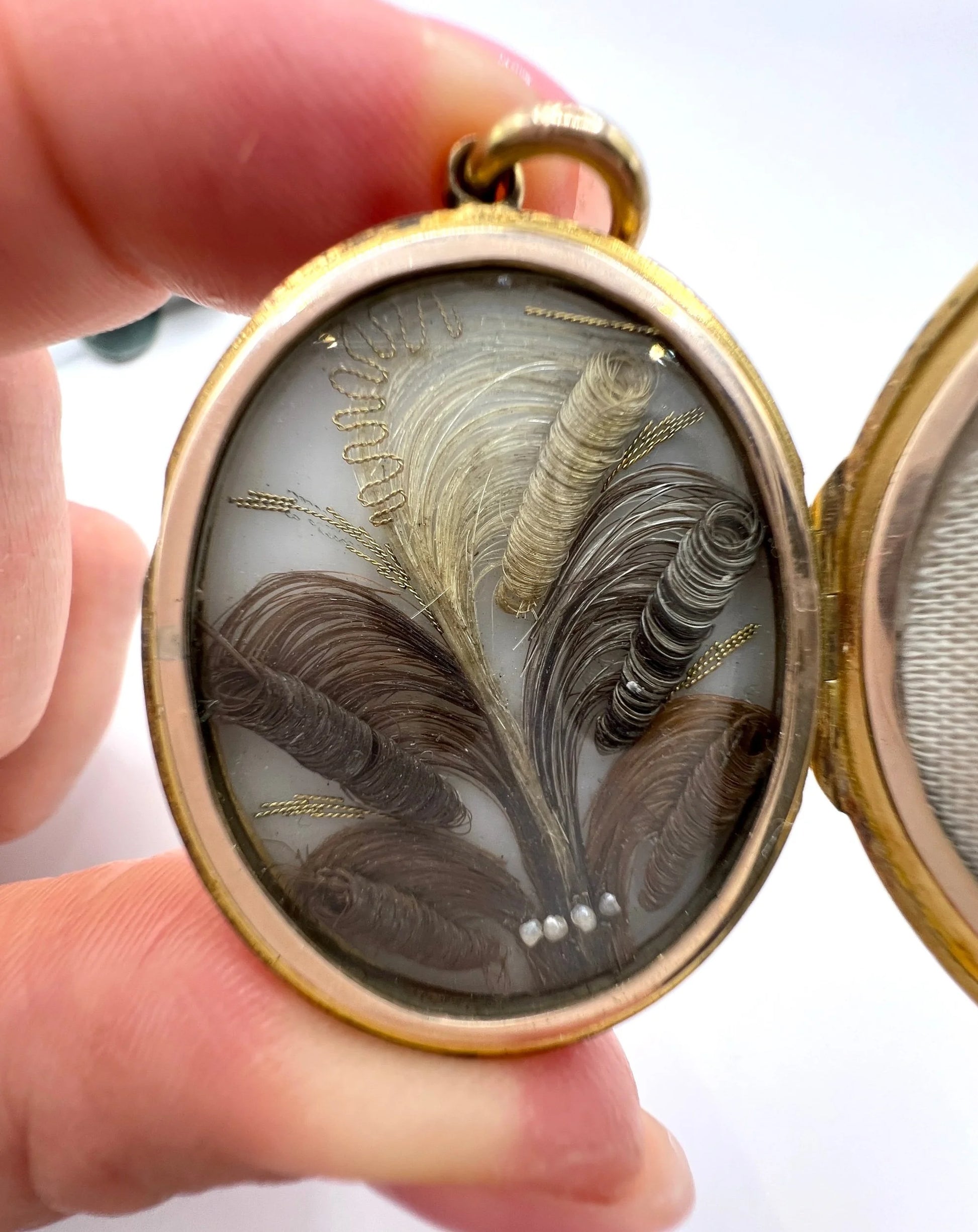 Early Victorian 15 Carat Yellow Gold Floral Engraved Oval Shaped Locket, Circa 1860