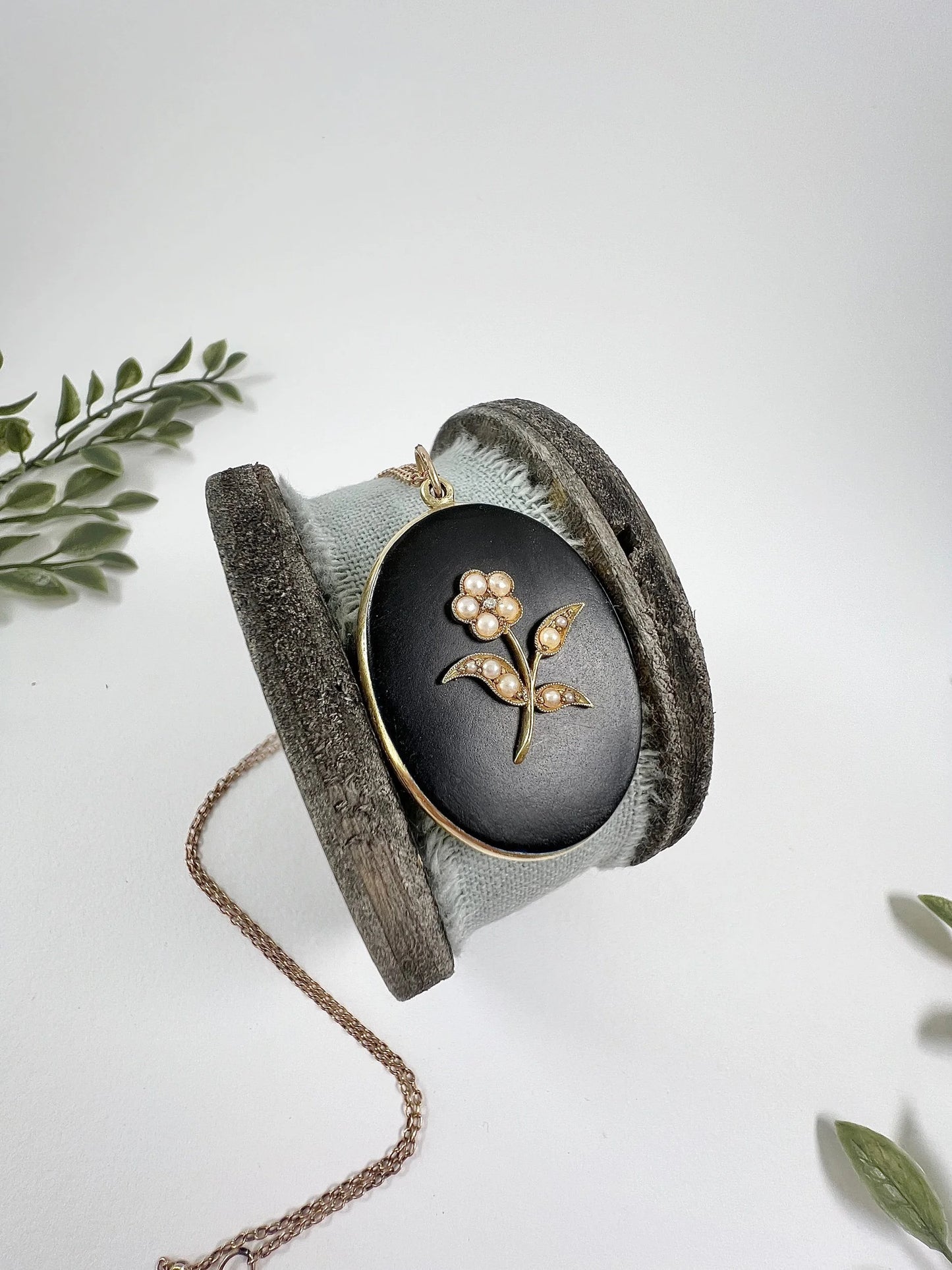 Edwardian 18 Carat Yellow Gold Onyx and Seed Pearl Flower Locket, Circa 1900