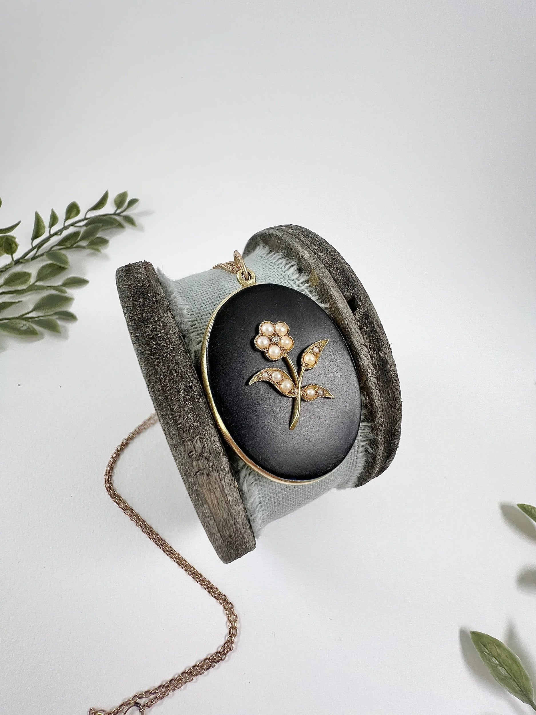 Edwardian 18 Carat Yellow Gold Onyx and Seed Pearl Flower Locket, Circa 1900