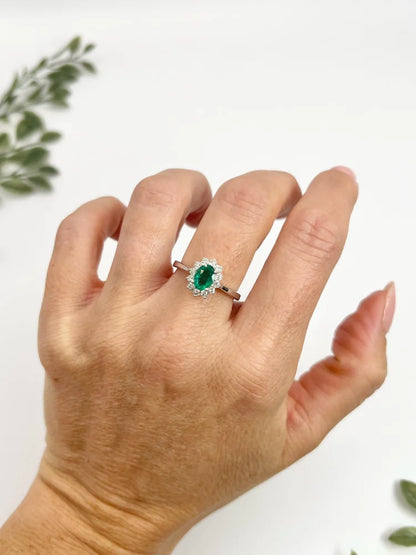 Emerald And Diamond Cluster Ring In 18 Carat White Gold
