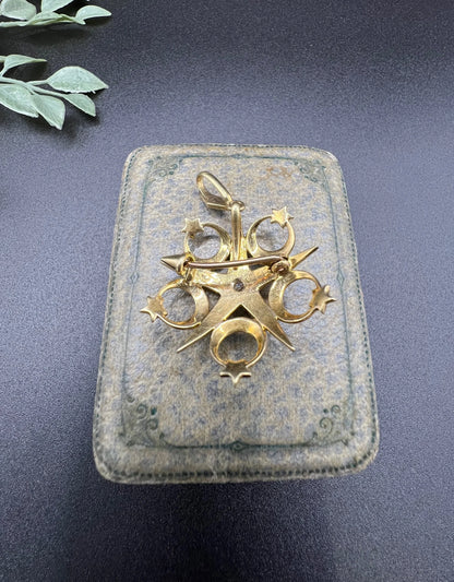 A yellow gold star and crescent brooch/pendant set with a diamond and pearls