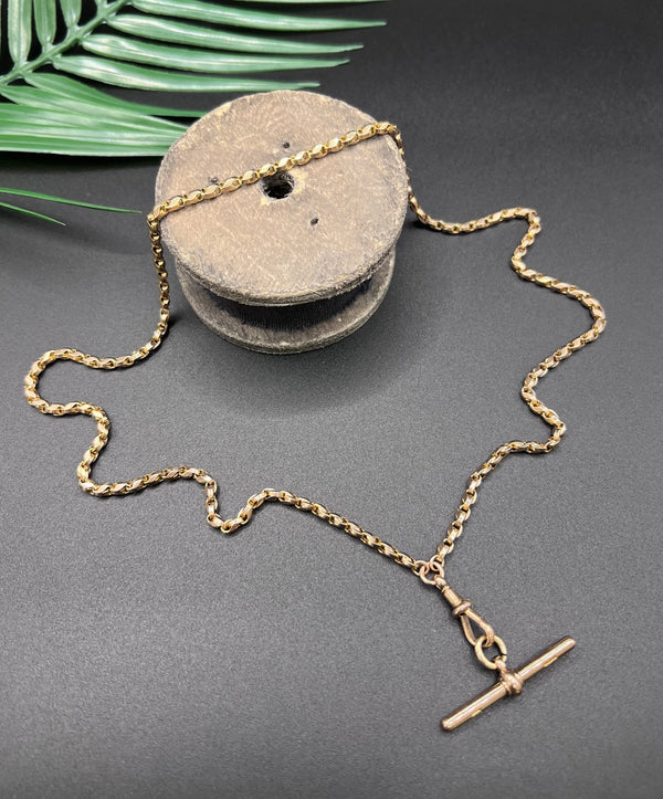 A rose gold tulip link chain necklace with a dog clip clasp and T-bar