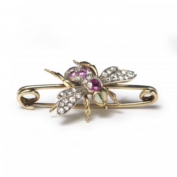 Antique Victorian Diamond, Ruby and Opal Bee Brooch; set with two opals for the eyes, round and cushion-shaped rubies and rose-cut diamonds to the body, and rose-cut diamonds in the wings, in silver and 18ct gold
