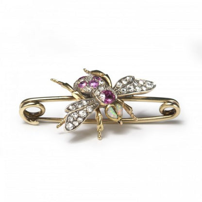 Antique Victorian Diamond, Ruby and Opal Bee Brooch; set with two opals for the eyes, round and cushion-shaped rubies and rose-cut diamonds to the body, and rose-cut diamonds in the wings, in silver and 18ct gold