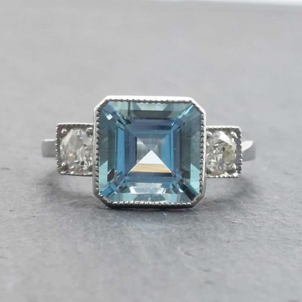 3ct Octagonal Cut Aquamarine and Diamond Three Stone Ring in Platinum
