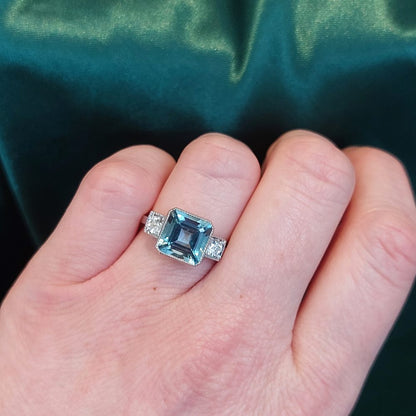 3ct Octagonal Cut Aquamarine and Diamond Three Stone Ring